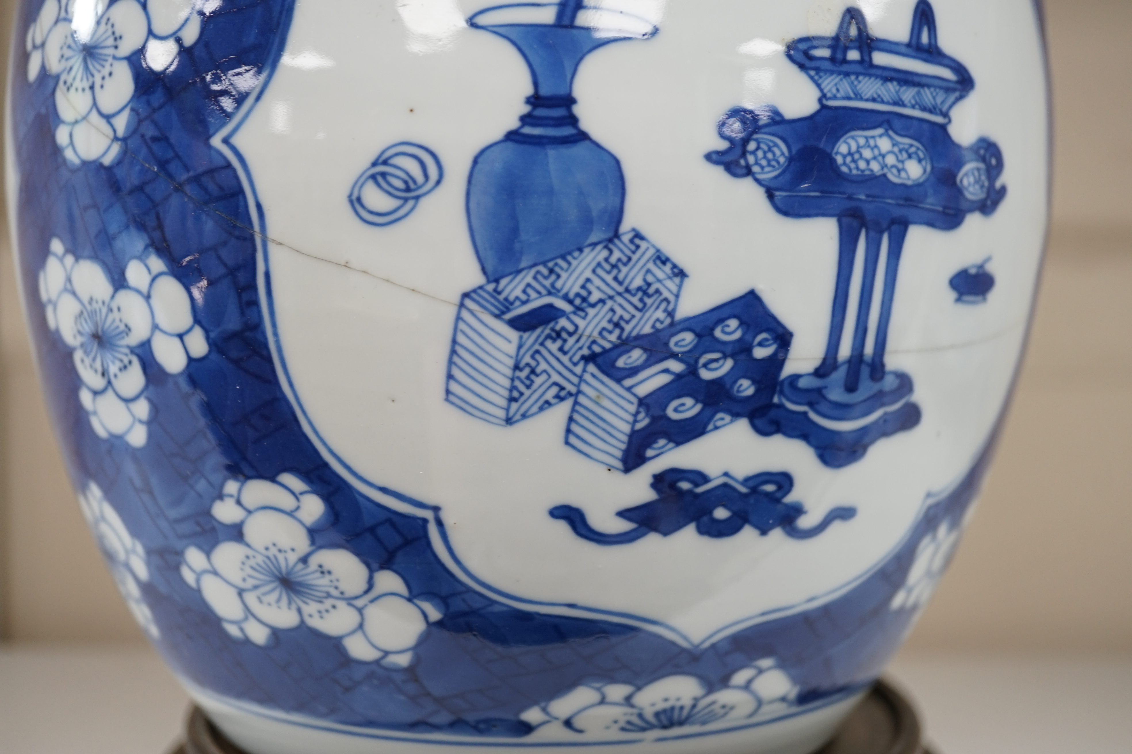 A Chinese blue and white ‘Antiques’ jar, Kangxi period, cracked